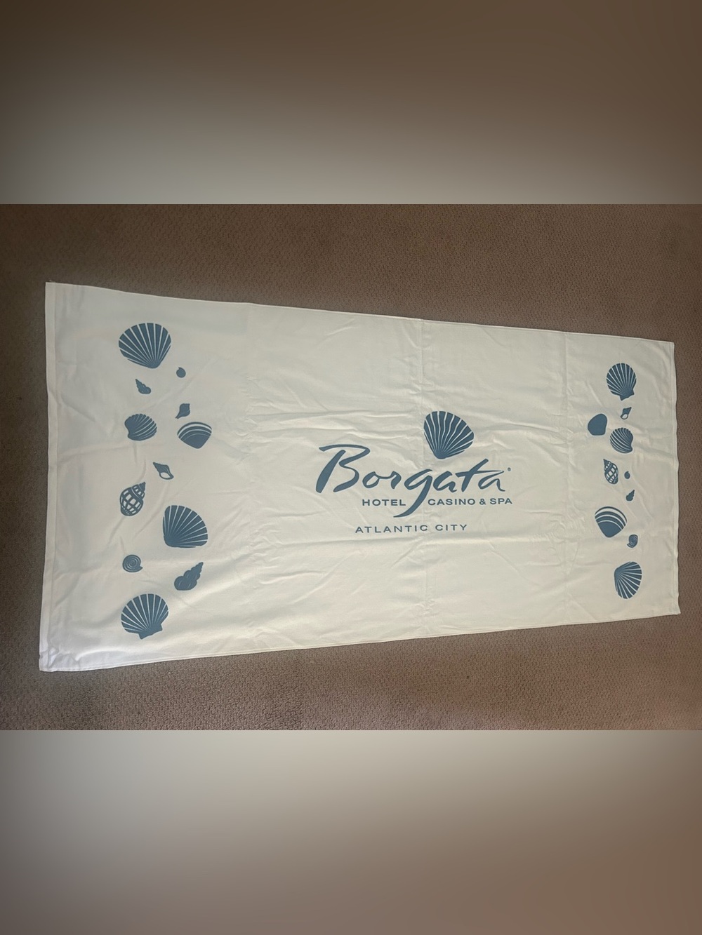 Borgata casino Atlantic City White Beach Towel with Blue Shell Motif